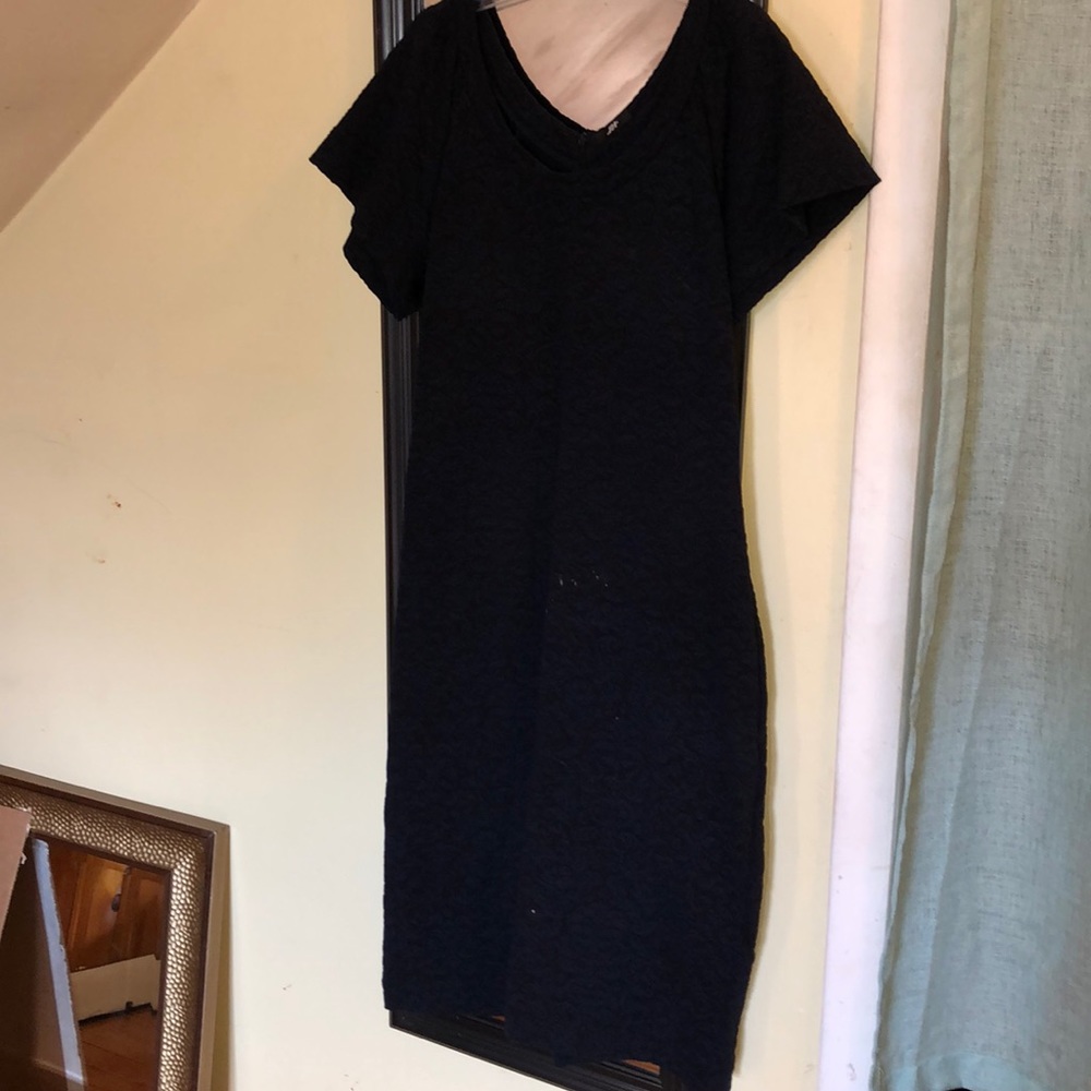 A black dress with navy blue detailing.